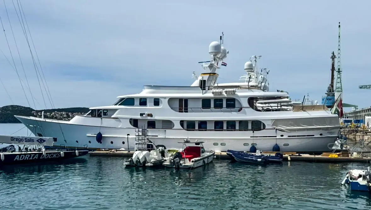 Royal Hakvoort 46-metre motor yacht with a freshly repainted white hull and navy boot stripe on the travel lift.